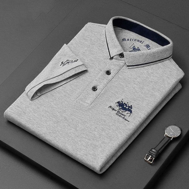 Comfortable men's classic polo shirt. This short-sleeve button-up top offers refined style for daily casual wear.