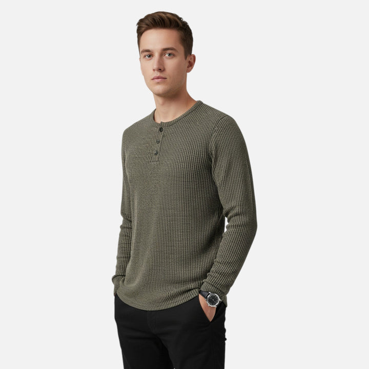 Sophisticated men's cable-knit henley sweater. Stylish pullover knitwear for a classic layering look.