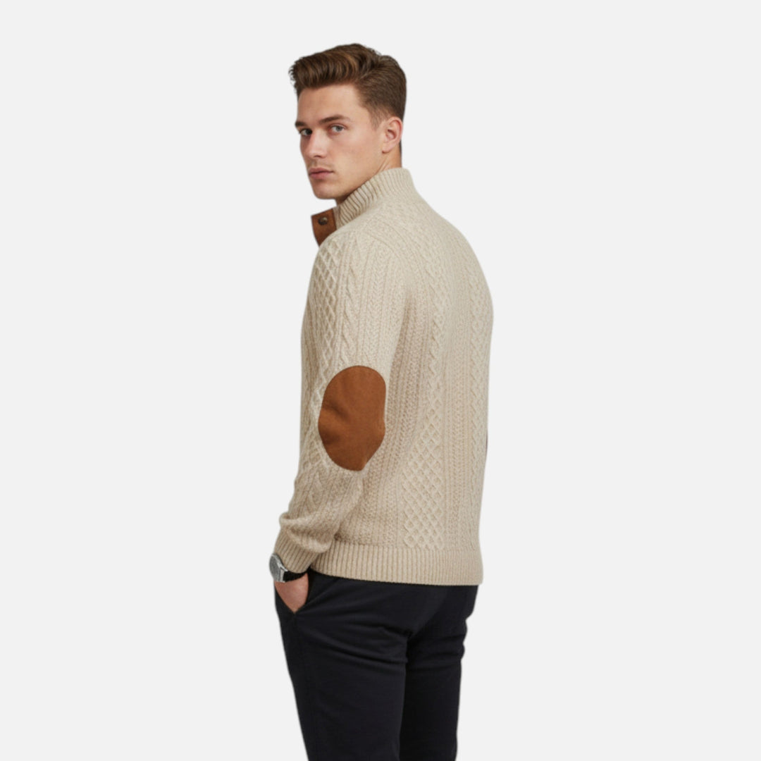 Detailed view of the intricate cable knit pattern on a men's classic pullover sweater.