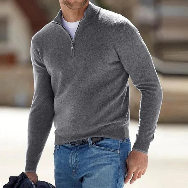 Model wearing a versatile men's grey cashmere jumper, perfect for casual or business casual.