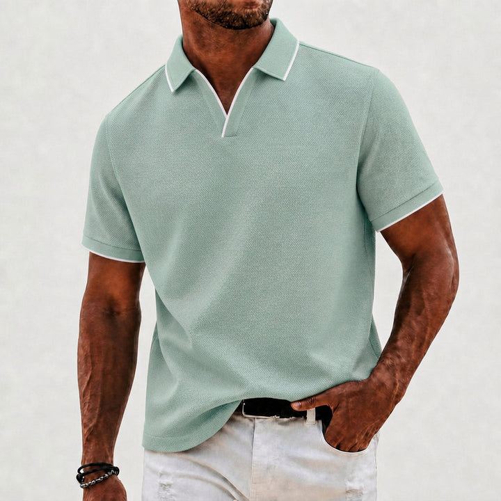 Elegant men's knit polo shirt with classic collar. Perfect for versatile smart-casual and everyday style.