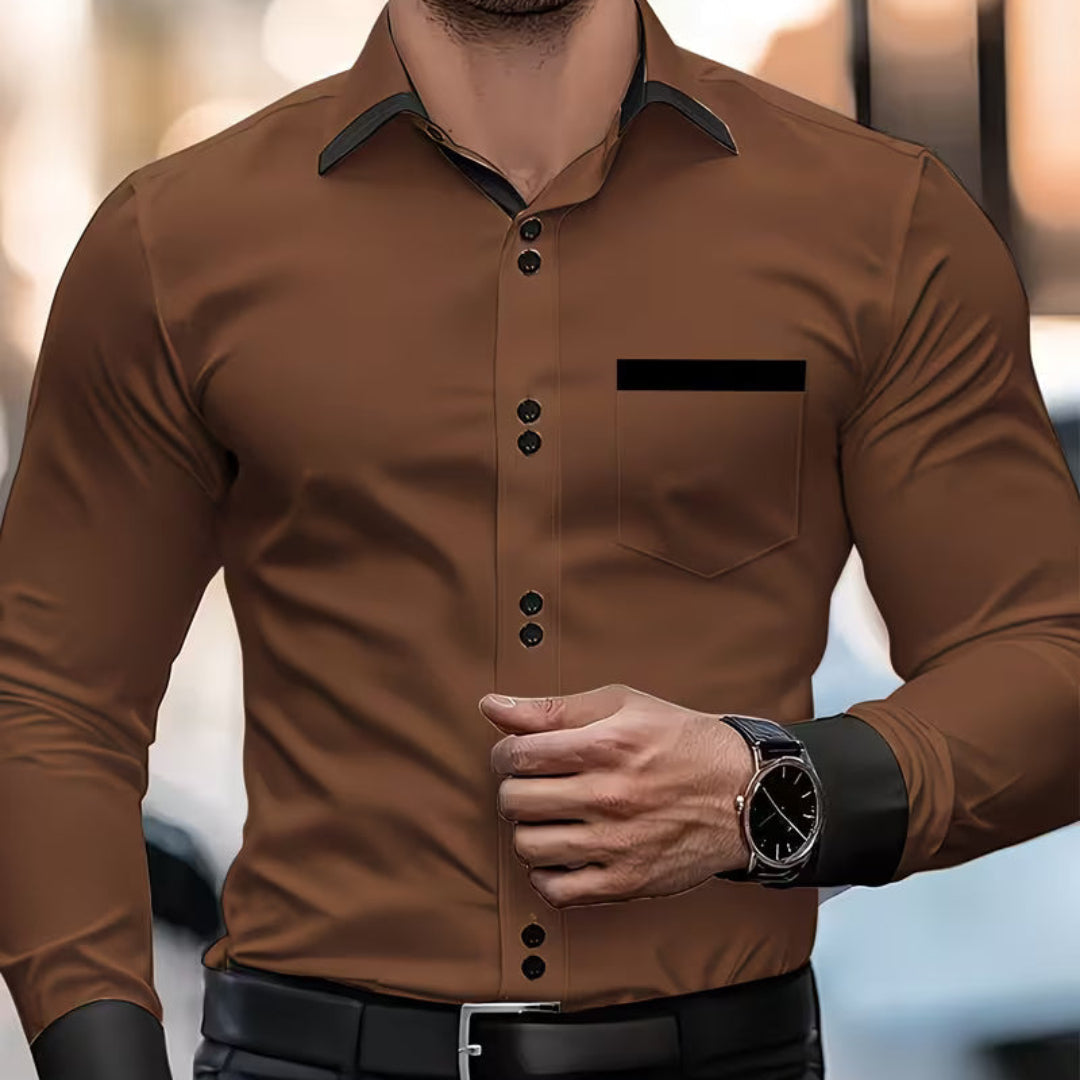 Crisp white men's slim fit collared shirt. Classic long-sleeve button-down for a sharp, modern men's fashion look.