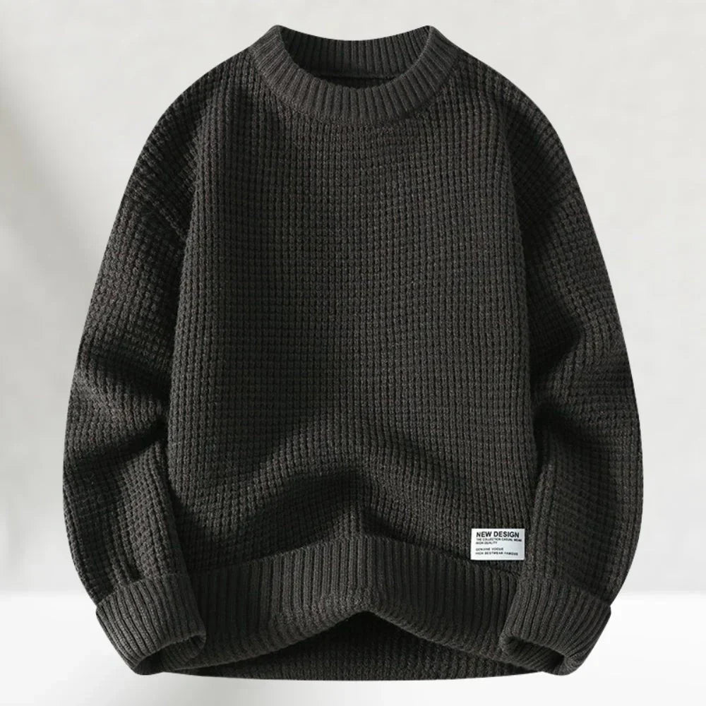 Close-up of a soft, long-sleeve men's pullover sweater with a ribbed crew neck, ideal casual wear.