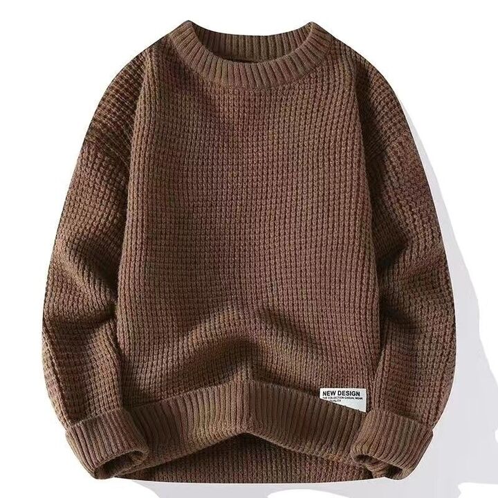 Man wearing a comfortable, casual mens sweater, featuring a timeless crew neck design and long sleeves.