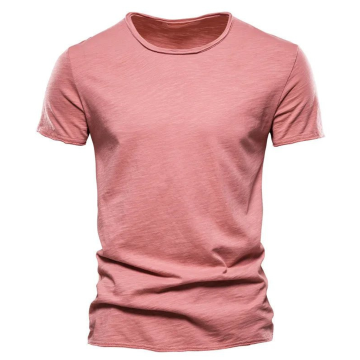 Stack of men's classic t-shirts in various colors, highlighting basic tee essentials.