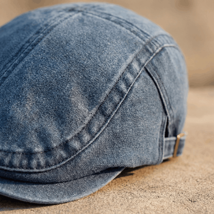 Close-up of a men's classic comfort flat cap fabric, showcasing quality texture.