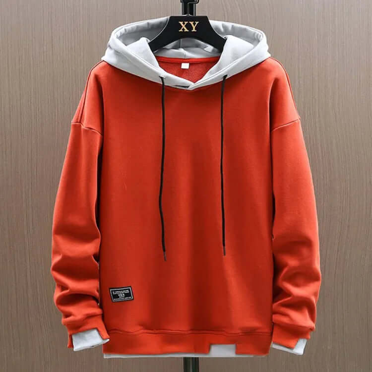 Soft men's green pullover hoodie, providing warmth with an adjustable hood and spacious front pockets for daily wear.
