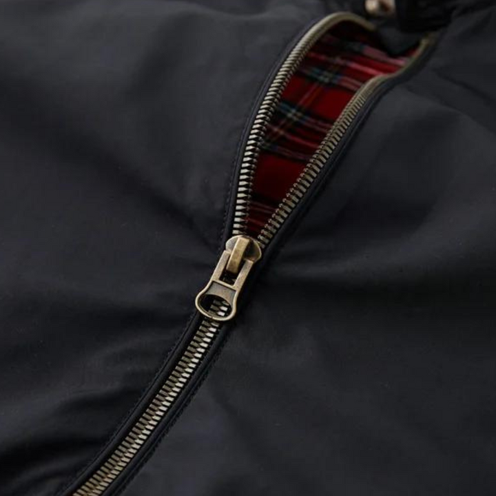 Man wearing a classic Harrington jacket with tartan lining, styled for a modern casual and smart look.