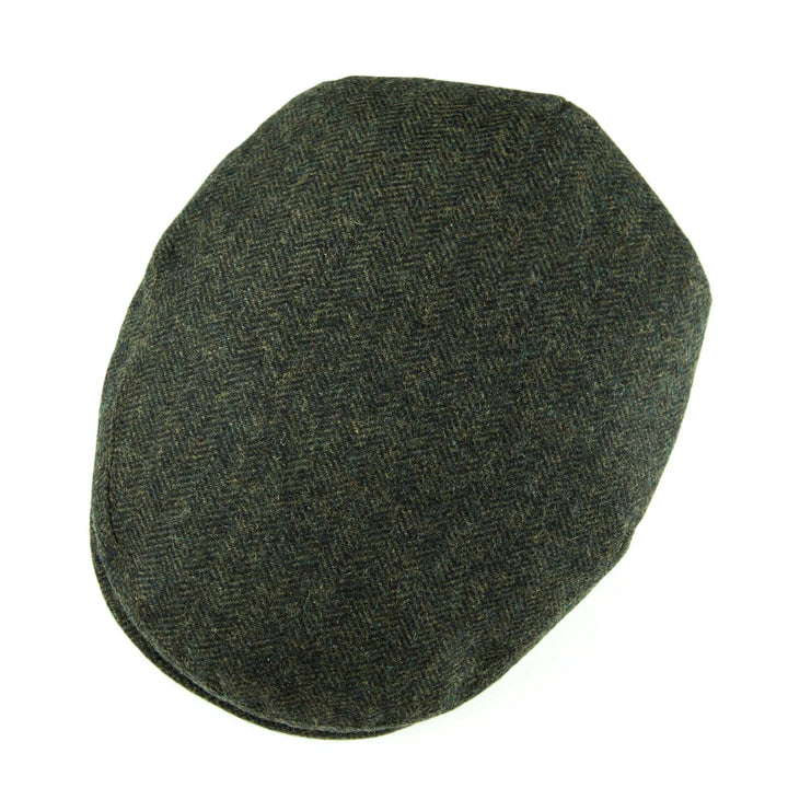 Versatile men's classic flat cap in herringbone, suitable for various casual outfits.