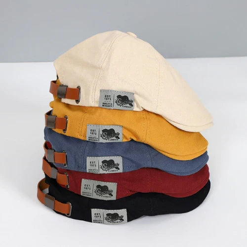 Men's classic ivy cap with a button top and paneled design. Perfect for casual wear and a timeless look.