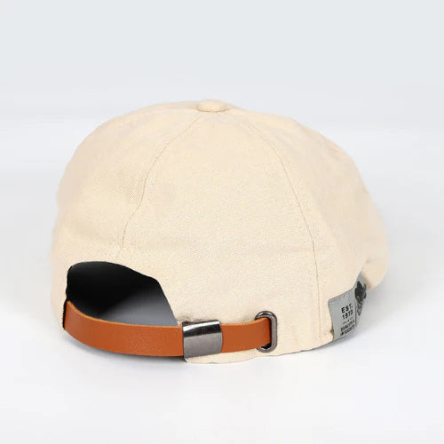Fashion-forward men's flat cap. This paneled ivy cap with a button top offers a comfortable, adjustable fit.