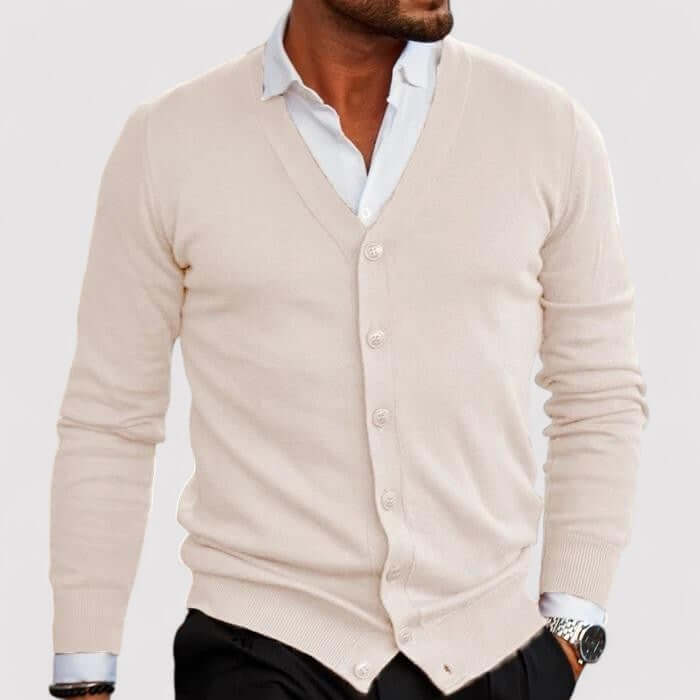 Man wearing a classic gray knitted cardigan sweater over a white t-shirt, demonstrating stylish layering.