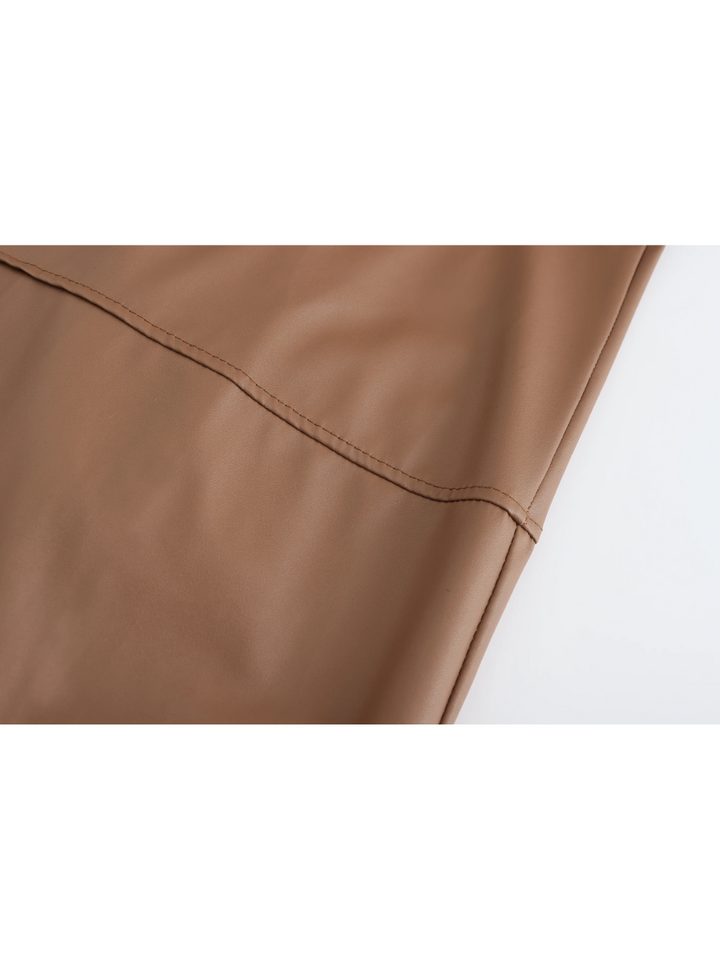 Outfit idea: men's classic long leather coat paired with casual wear.