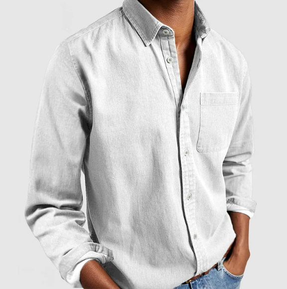 Stylish man wearing a timeless long-sleeve button-down shirt, perfect for casual or smart-casual occasions.