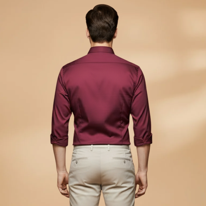 Model wearing a men's grey button-down shirt, long sleeve, smart casual, perfect for work.
