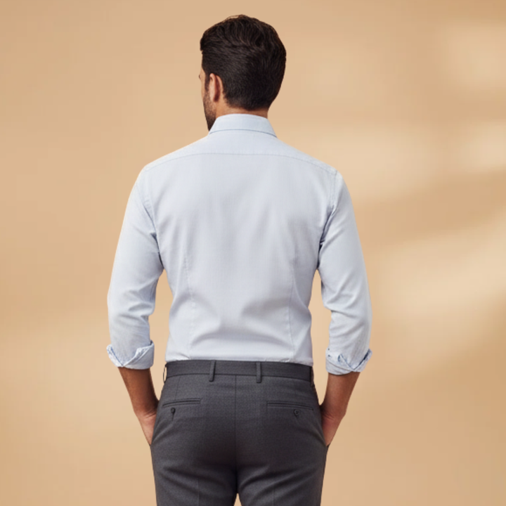 Versatile blue long sleeve button-up shirt for men, suitable for both casual outings and business.
