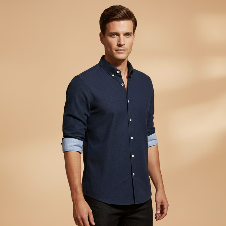 Detailed view of the quality buttons on a men's classic long sleeve button-up shirt, highlighting its structured, timeless style.