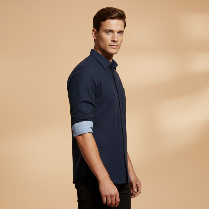 Man wearing a classic long sleeve button-up shirt, styled casually for an everyday relaxed, yet structured fit.