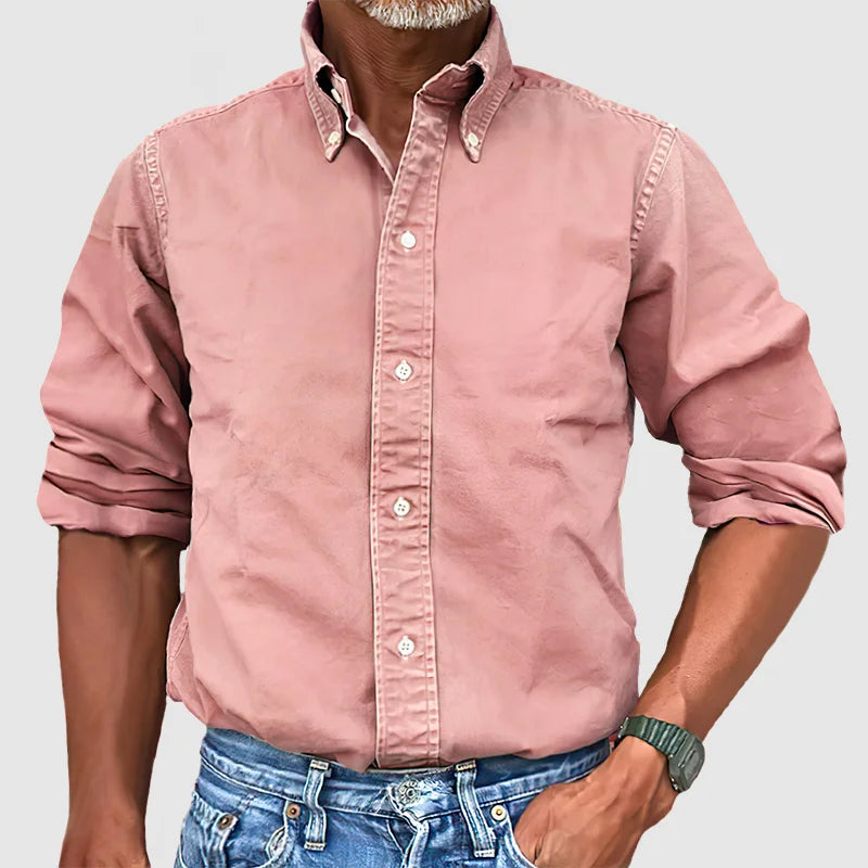 Close-up of the crisp collar and cuffs on a men's classic long-sleeve button-up shirt.