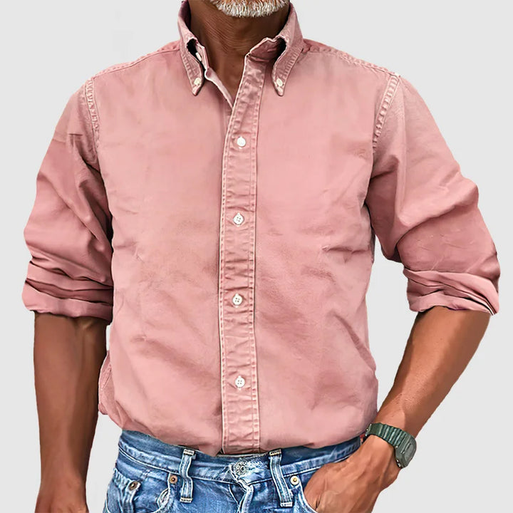 Close-up of the crisp collar and cuffs on a men's classic long-sleeve button-up shirt.