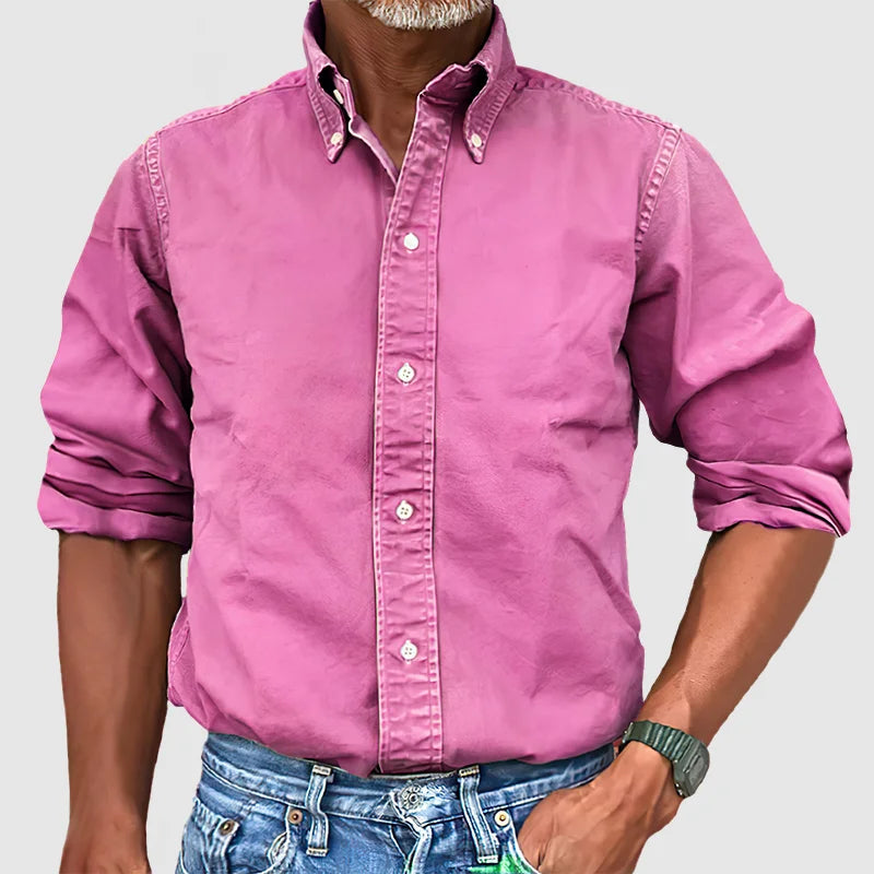 Neatly folded men's classic long-sleeve button-up shirt, ready for everyday wear.