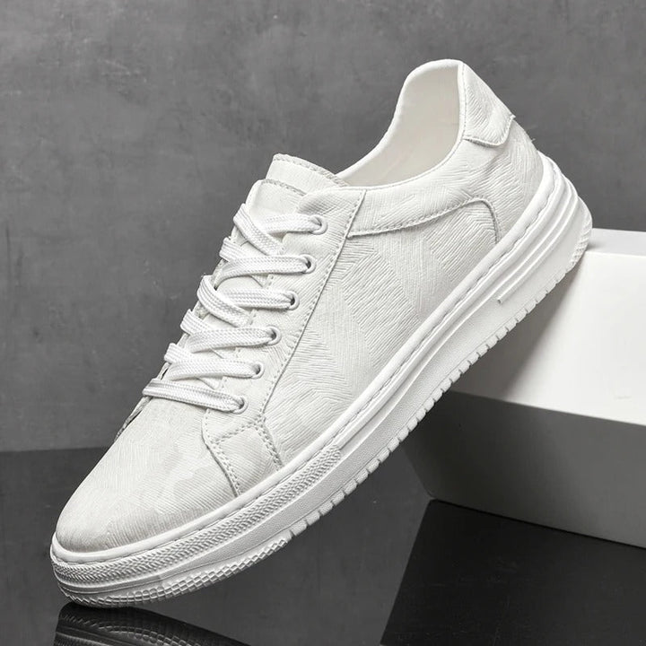 Men's classic low-top lace-up sneakers. Essential versatile trainers for modern casual outfits.