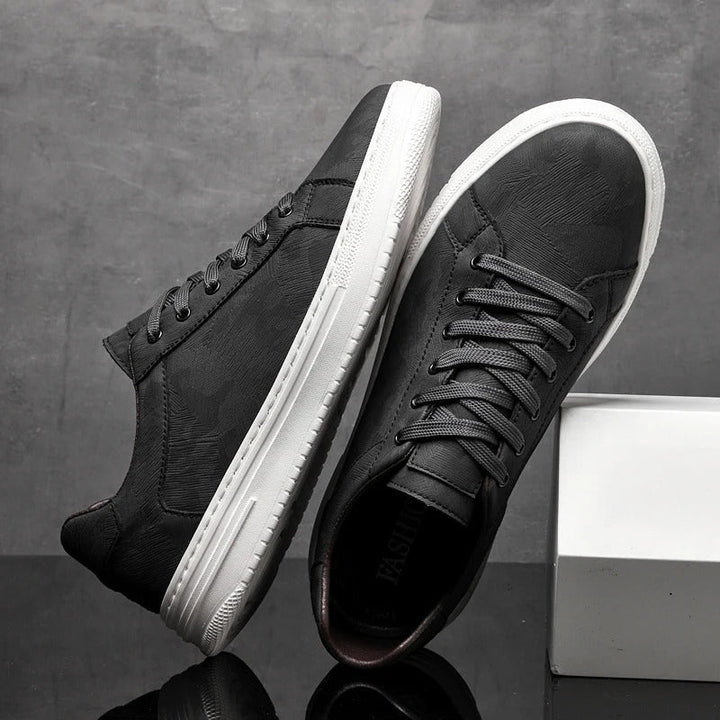 Modern design men's low-top lace-up trainers. Comfortable athletic style casual sneakers for effortless wear.