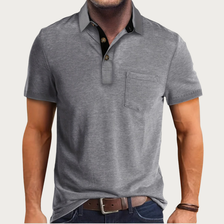 Close-up of the breathable fabric on a men's classic polo shirt, highlighting comfort and quality menswear.