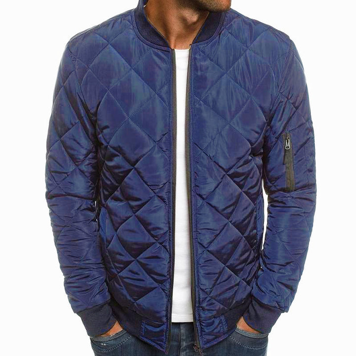 Man wearing classic quilted bomber jacket, stylish everyday outerwear for autumn and winter fashion.