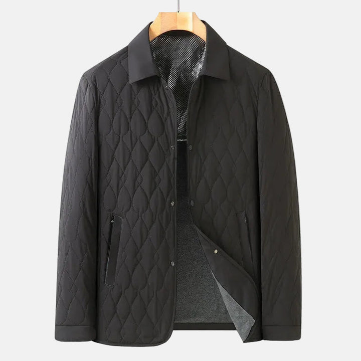 Versatile men's quilted button-down jacket, a stylish lightweight option for casual fall, winter & spring wear.