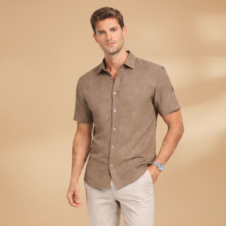 Classic men's short sleeve button-up shirt, a versatile top for warm weather & casual style.