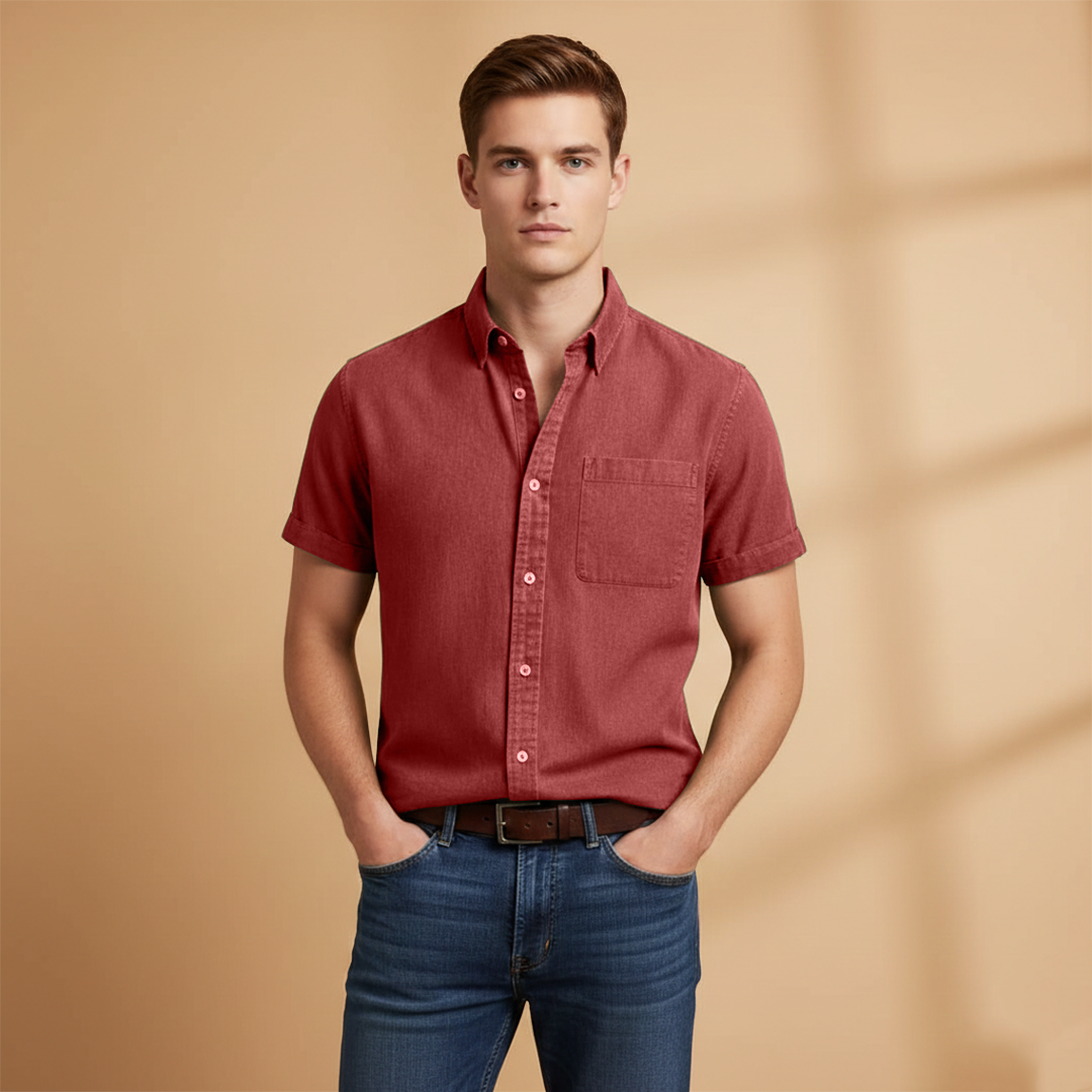 A crisp men's short-sleeve shirt, featuring a chest pocket for added style