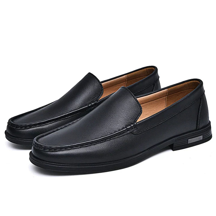 Elegant black slip-on loafers for men, a classic footwear choice for style & comfort.