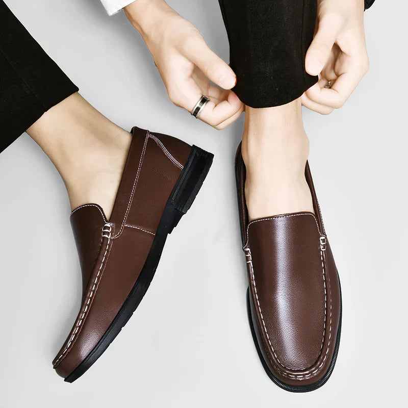 Stylish men's brown slip-on loafers, classic footwear for a refined business casual look.