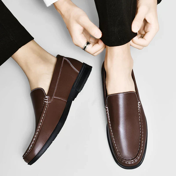 Stylish men's brown slip-on loafers, classic footwear for a refined business casual look.