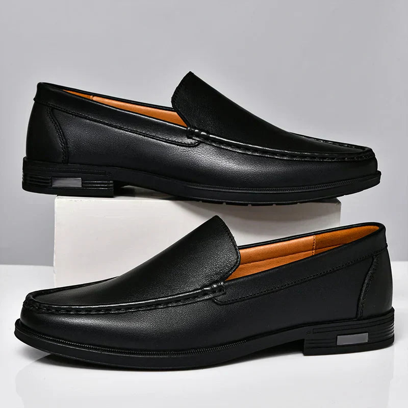 Stylish black men's loafers, classic slip-on design for formal & casual wear.