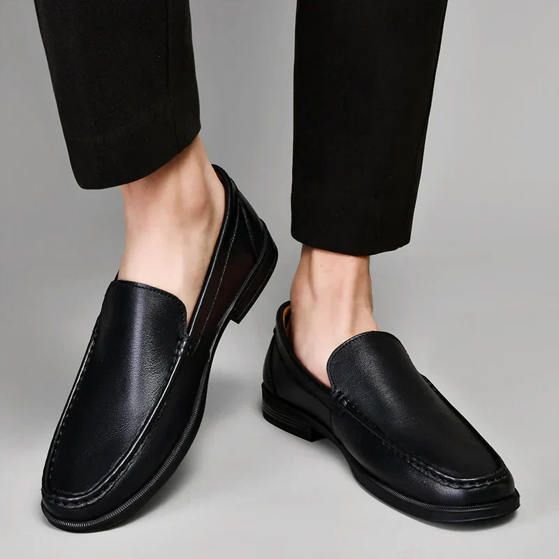 Versatile men's slip-on loafers in black, suitable for casual & business casual outfits.