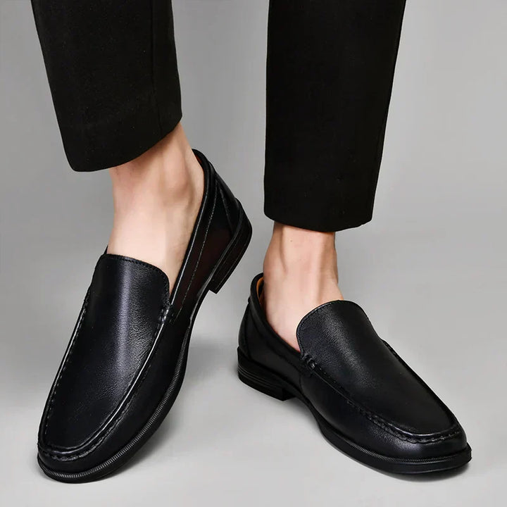 Versatile men's slip-on loafers in black, suitable for casual & business casual outfits.