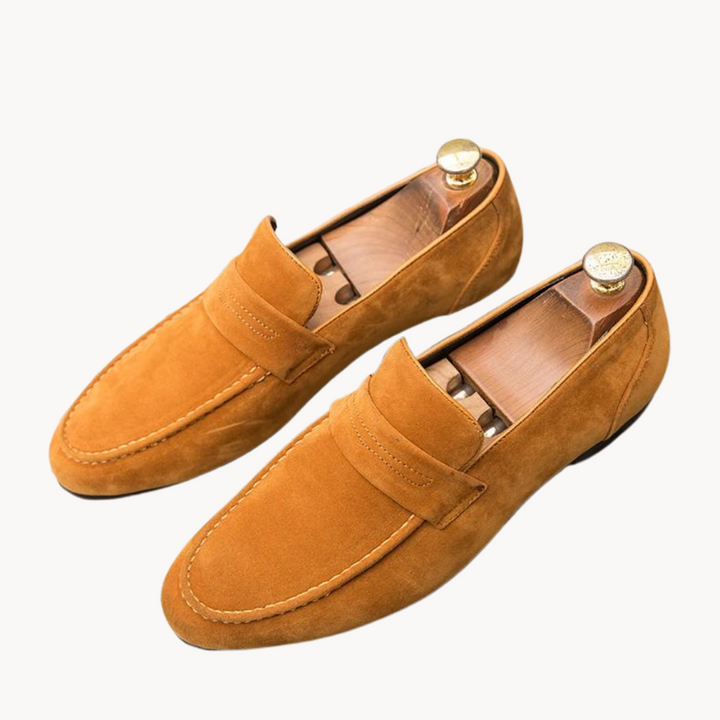 Lightweight & comfortable brown men's penny loafers. Classic slip-on design with a stylish matte finish for men's footwear.