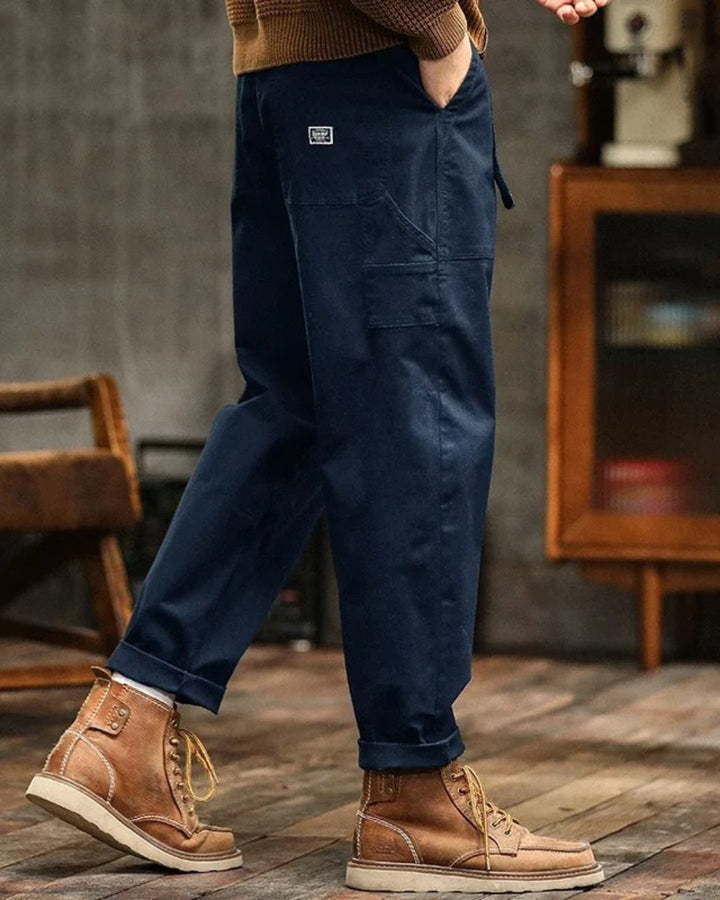 Khaki men's classic straight leg cargo pants featuring a pleated waist for comfortable, versatile style.