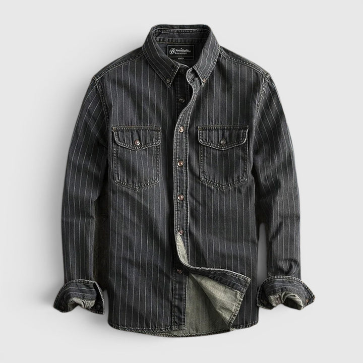 Model wearing a men's classic blue & black striped long sleeve button-up shirt, showcasing comfortable fit.