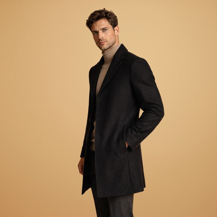 Back view of a men's timeless style overcoat, showcasing its clean, tailored silhouette.