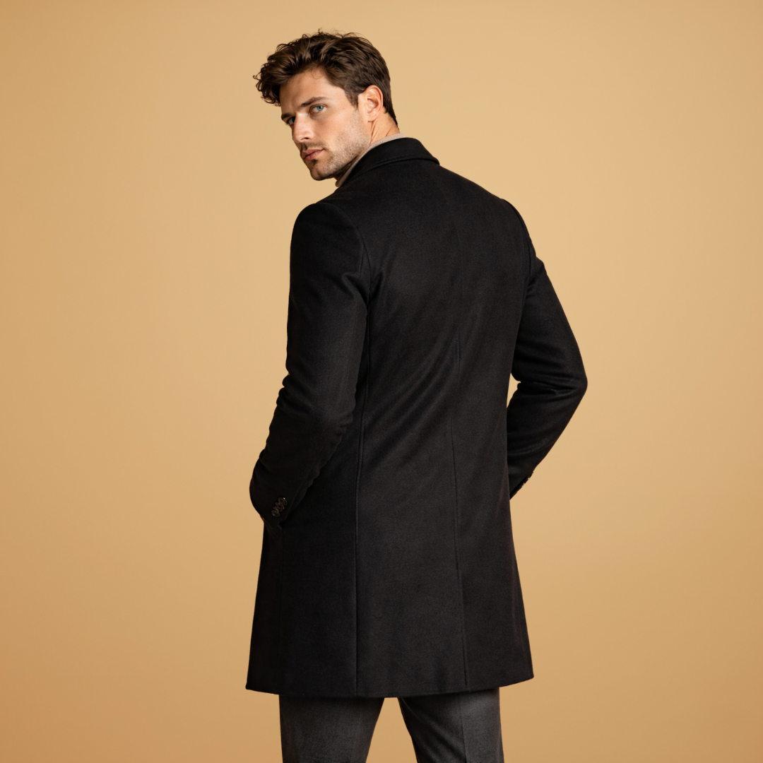 Model wearing a men's classic tailored overcoat, demonstrating sophisticated menswear.