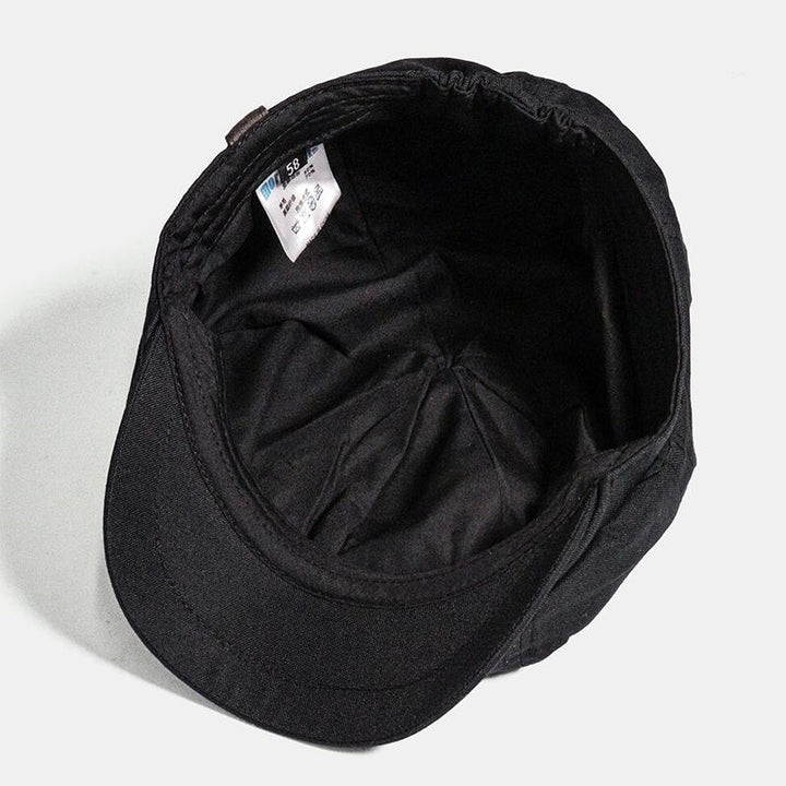 Gentleman's new vintage flat cap. Classic British fashion retro hat, stylish men's headwear for a refined look.