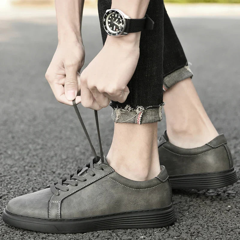 Side profile of men's versatile low-top trainers, perfect casual summer shoes with stylish contrast stitching.