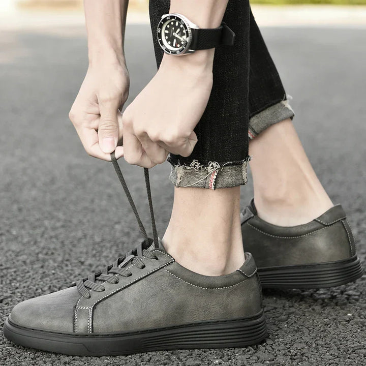 Side profile of men's versatile low-top trainers, perfect casual summer shoes with stylish contrast stitching.