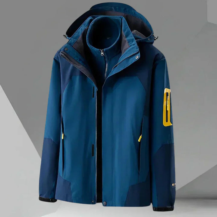 Close-up of a men's full zip hooded rain jacket, highlighting the durable fabric & color block details.