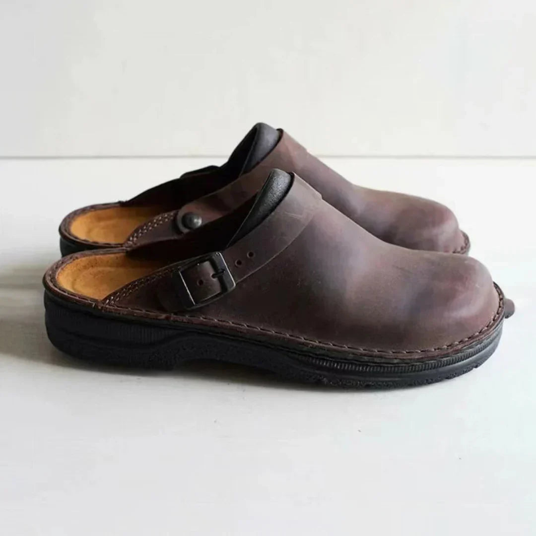 Versatile men's comfort clogs, ideal as house shoes or casual outdoor footwear. Features an easy slip-on, open-back design.