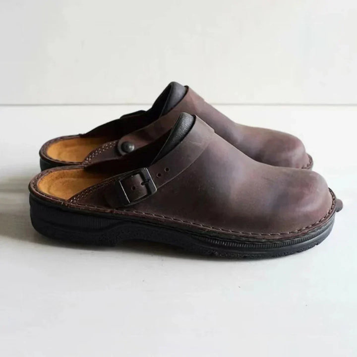 Versatile men's comfort clogs, ideal as house shoes or casual outdoor footwear. Features an easy slip-on, open-back design.