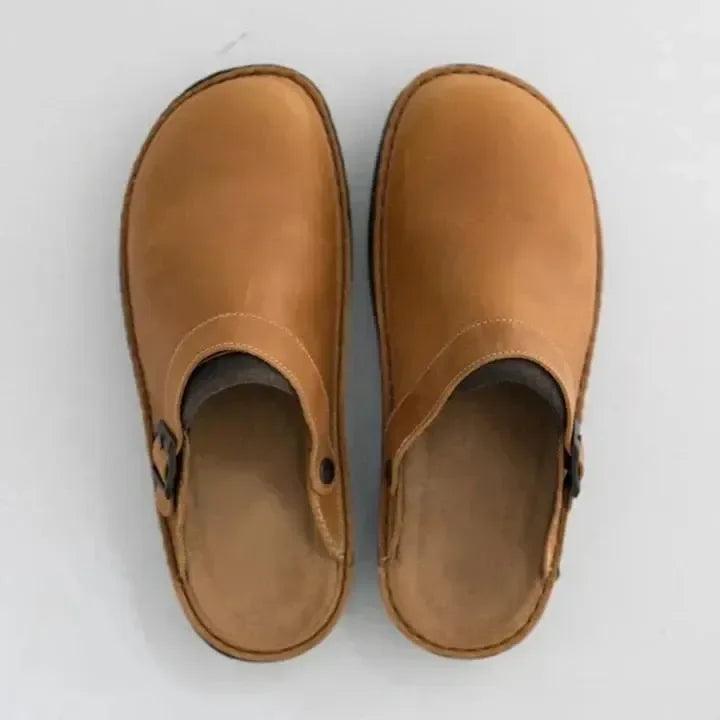 Supportive men's slippers offering superior comfort. Durable casual footwear for daily indoor & outdoor style.